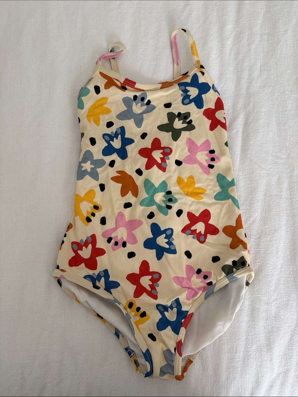 Hanna Andersson Cream One-Piece Swimsuit with Multicolor Star Print